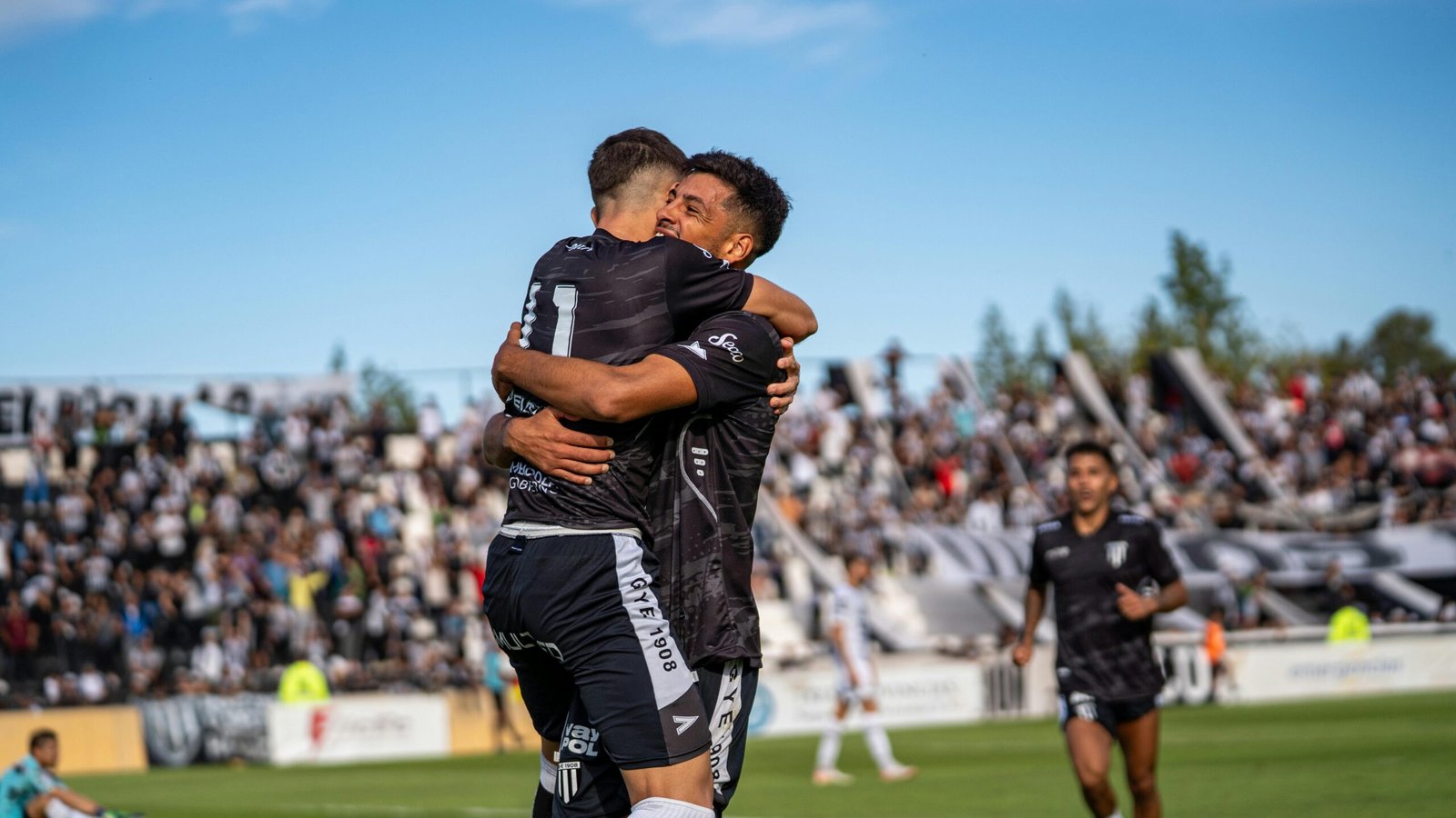 A professional Overwatch player celebrating victory after winning a crucial round