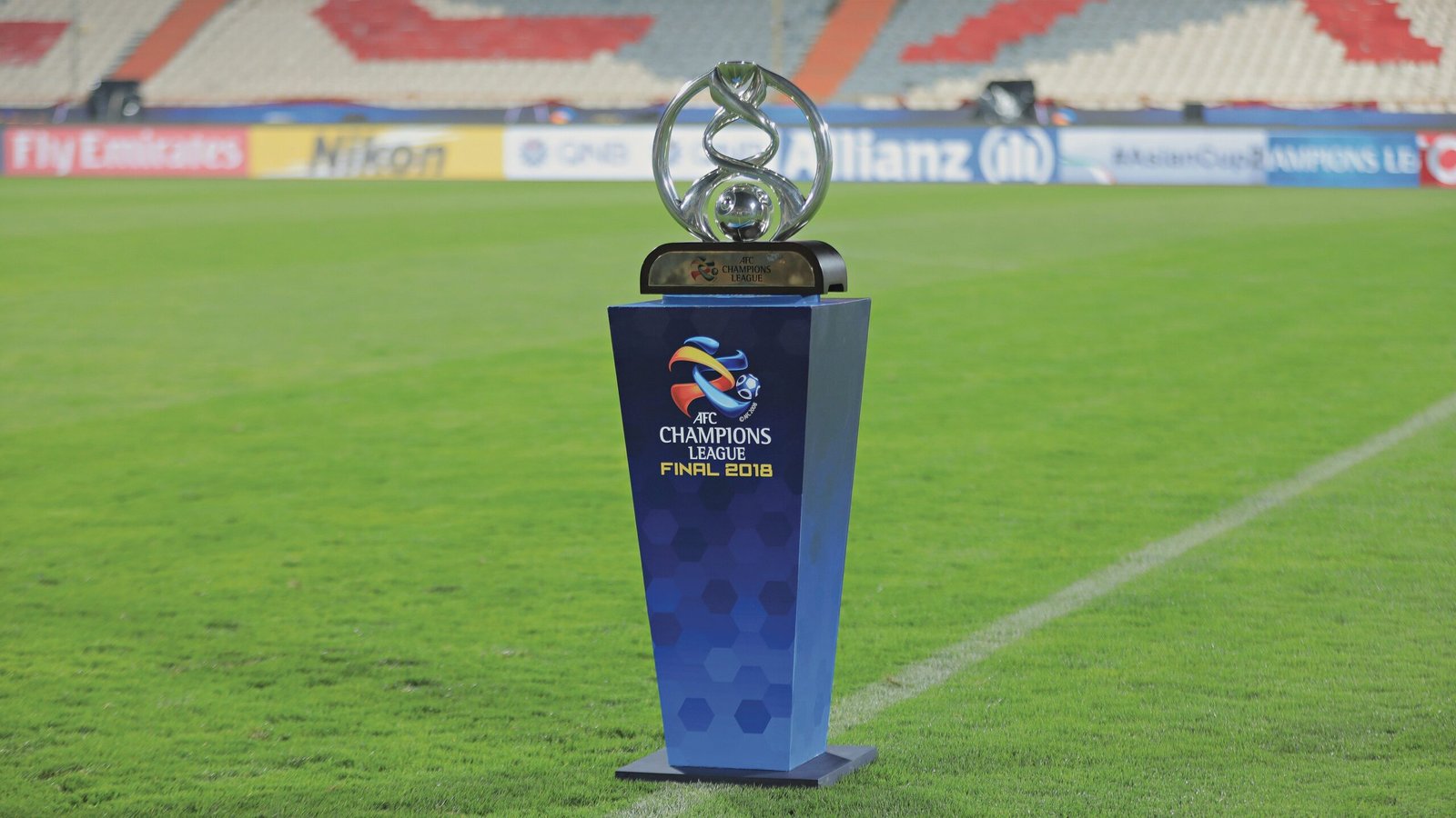 Overwatch players celebrating victory on stage