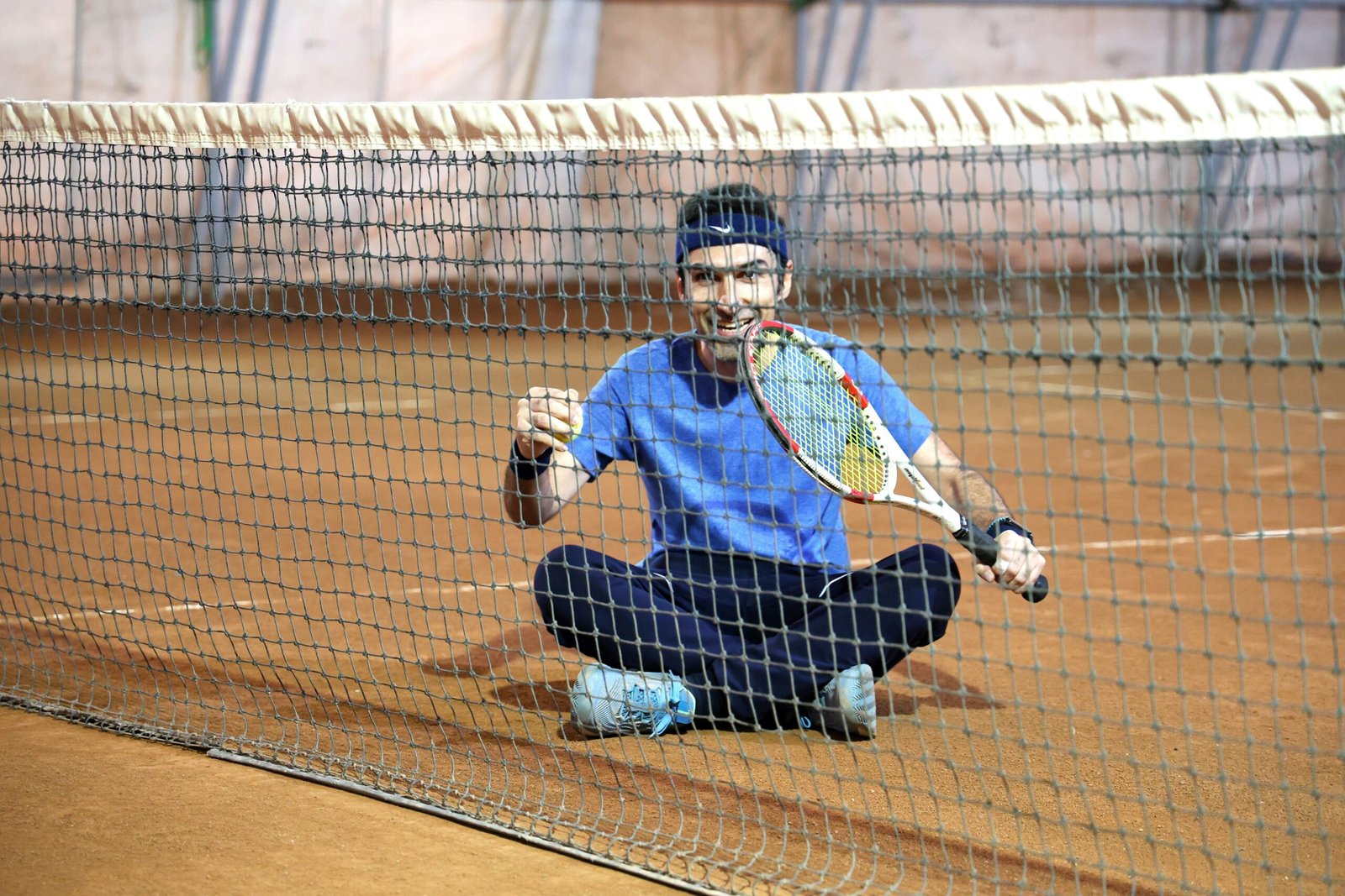 Players practicing together surrounded by monitors