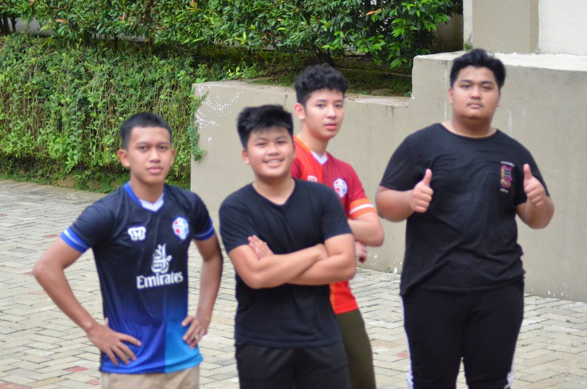 A group shot of an Overwatch League team celebrating after winning a match.